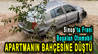 <center> Sinop’ta Freni Boşalan Otomobil  </center><center><font color=’blue’> APARTMANIN BAHÇESİNE DÜŞTÜ </font></center>
